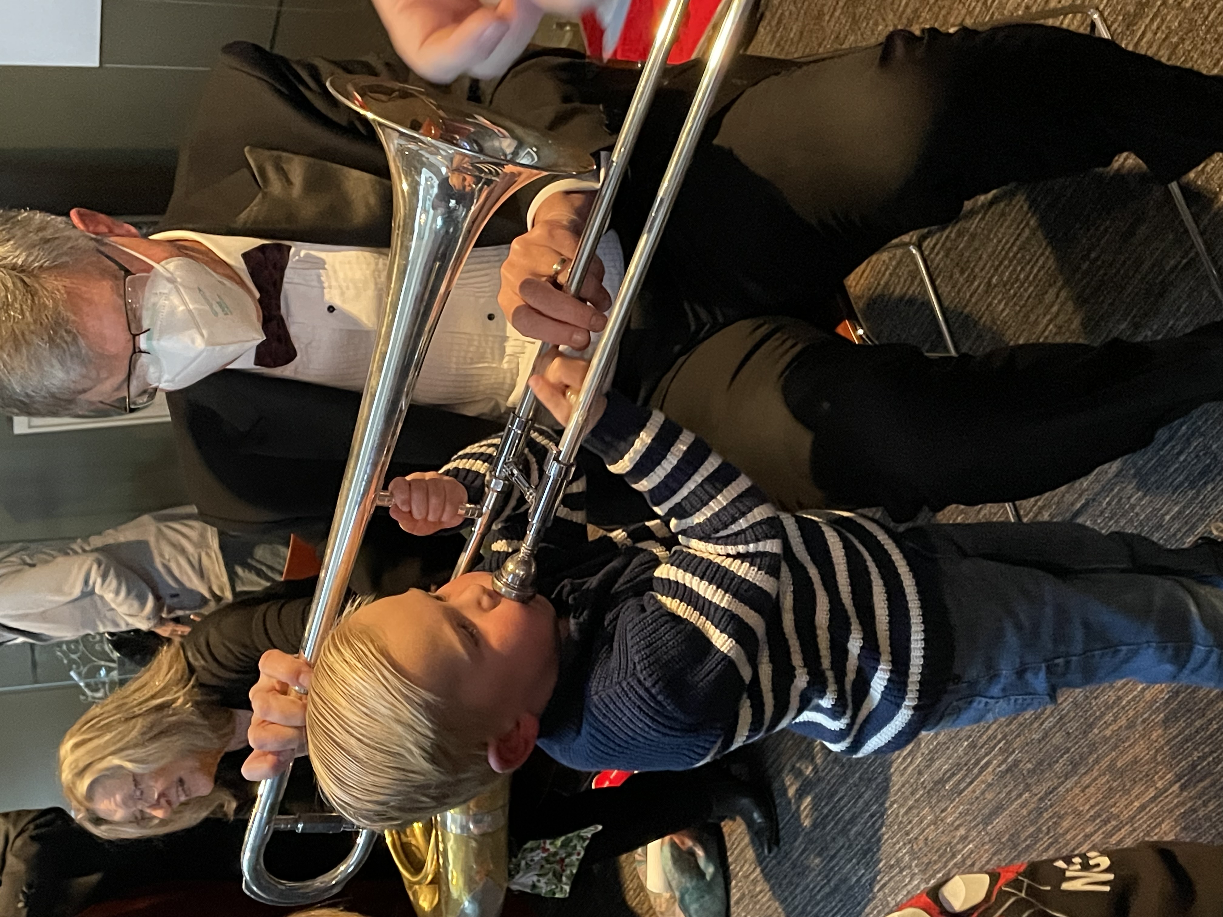 child meets trombone with LAS player Marcus Schildbach