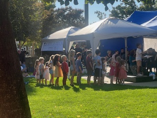 children queued up to conduct at Pops 2024